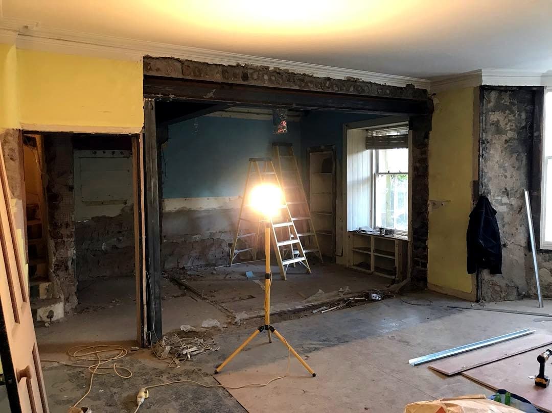 New steel beam over a structural opening, work light on a tripod