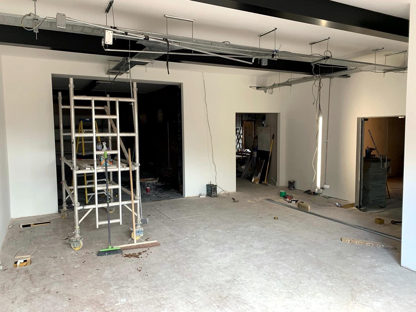 Commercial unit mid fit-out, scaffold tower under new steels